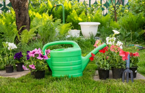 Landscaper conducting a safe garden maintenance task with tools and waste management